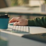 Man hand using computer mouse working at room closeup. Web designer at keyboard