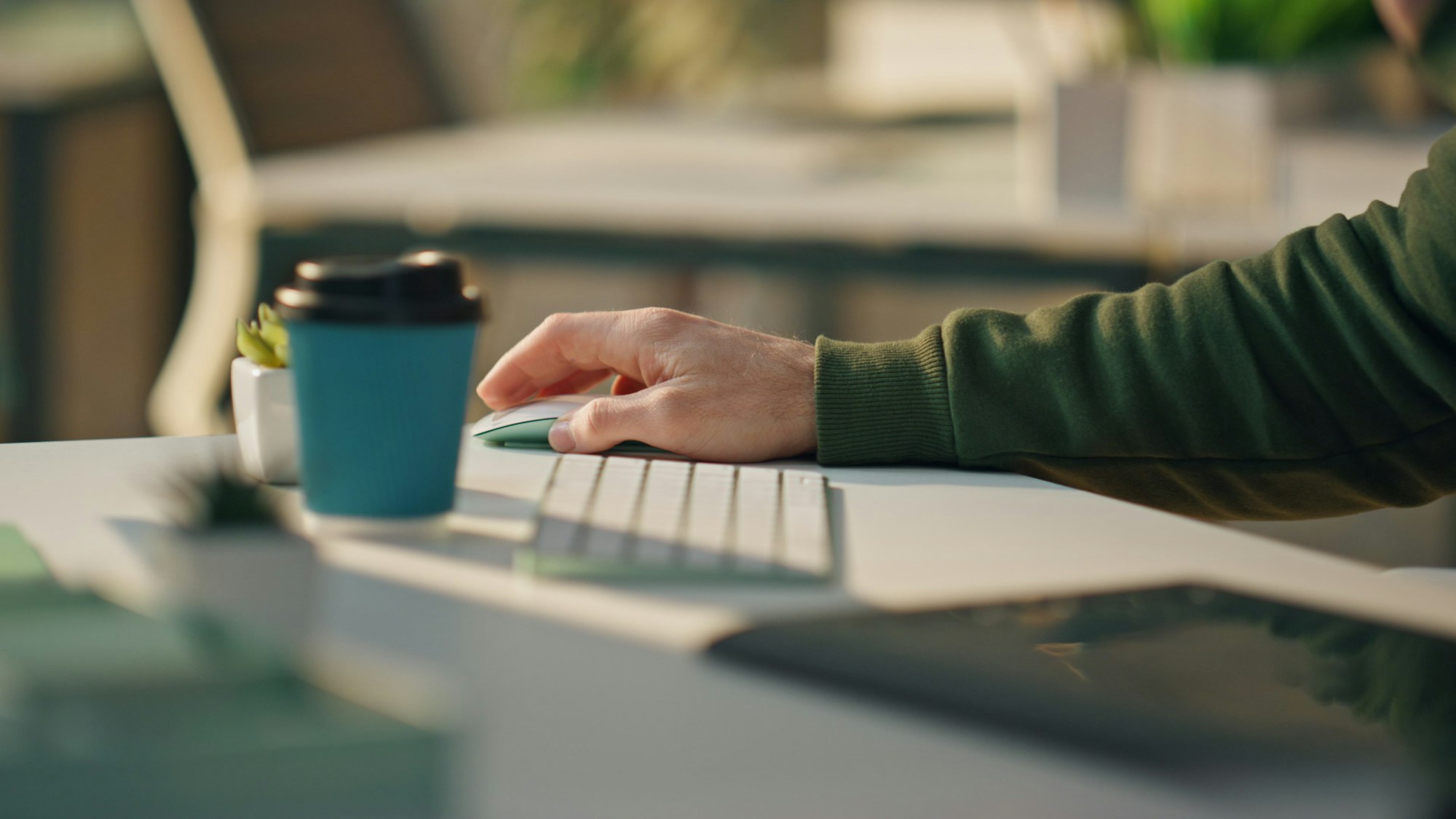 Man hand using computer mouse working at room closeup. Web designer at keyboard